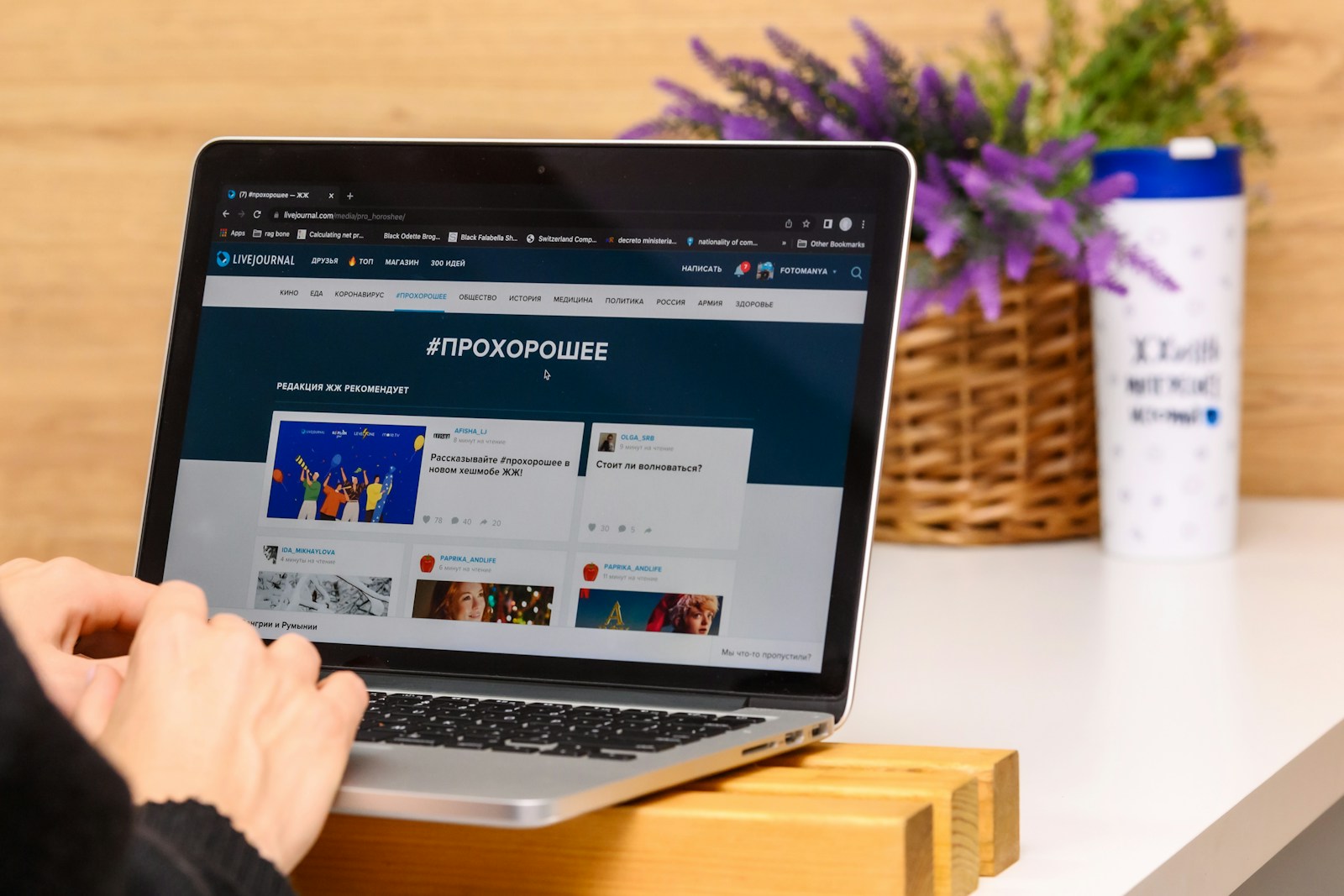 a person using a laptop computer on a desk